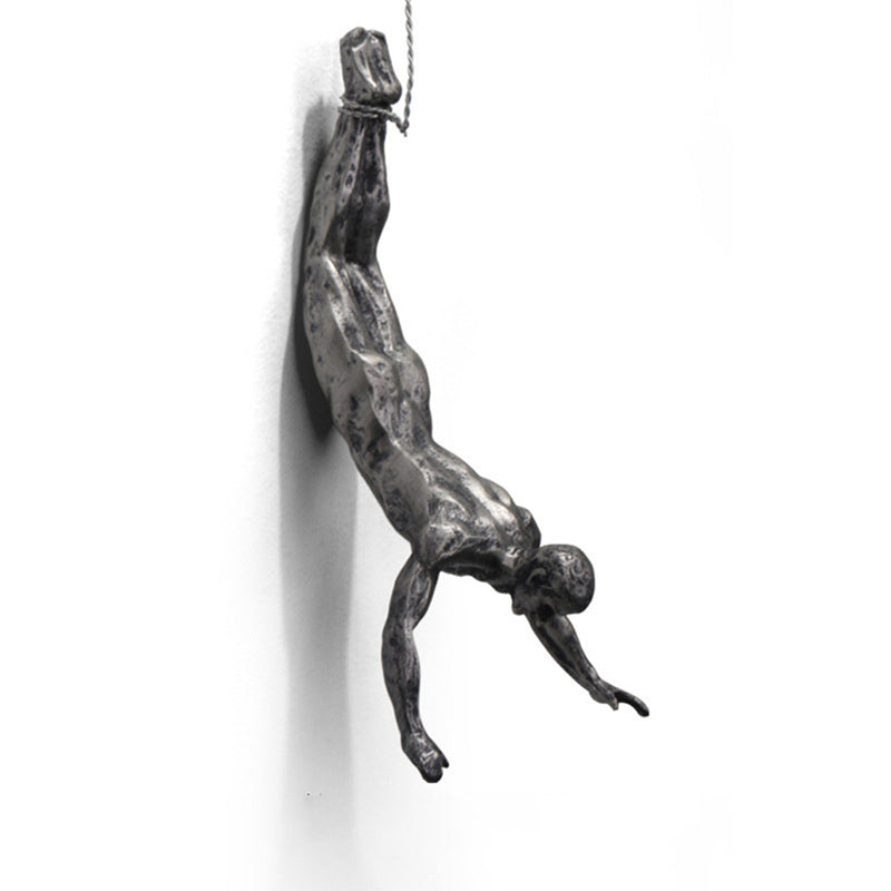 climbing man wall sculpture